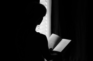 Woman reading poetry - c 2016 erie chapman